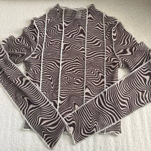 Sheer patterned top with white piping